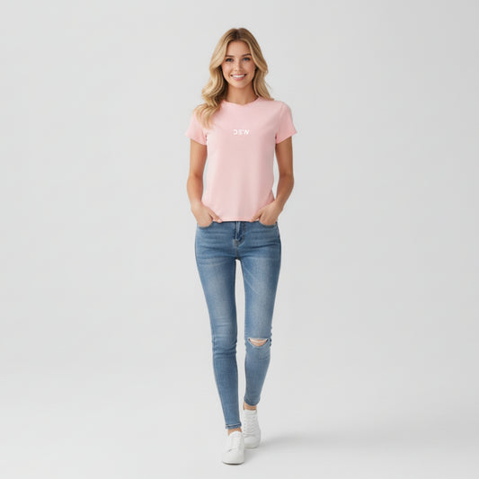 Woman wearing petal pink Dew tshirt in plain backgound