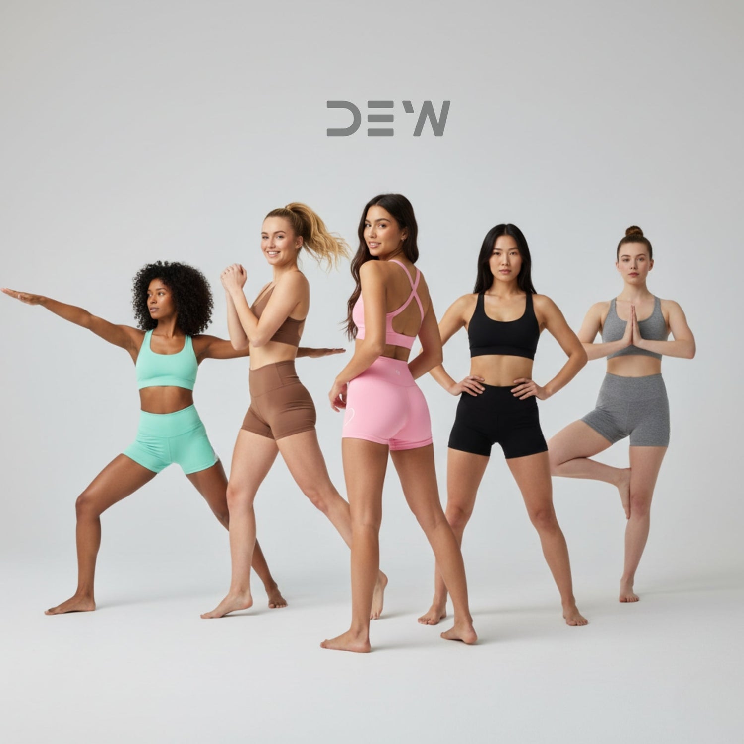 Diverse group of women posing in seamless high-waist shorts and sports bras in various colors. Image highlights activewear shorts collection and fit.