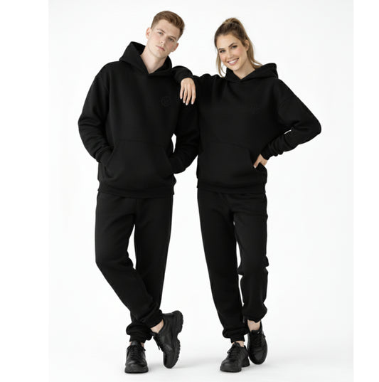 models wearing dew unisex oversized hoodies and joggers