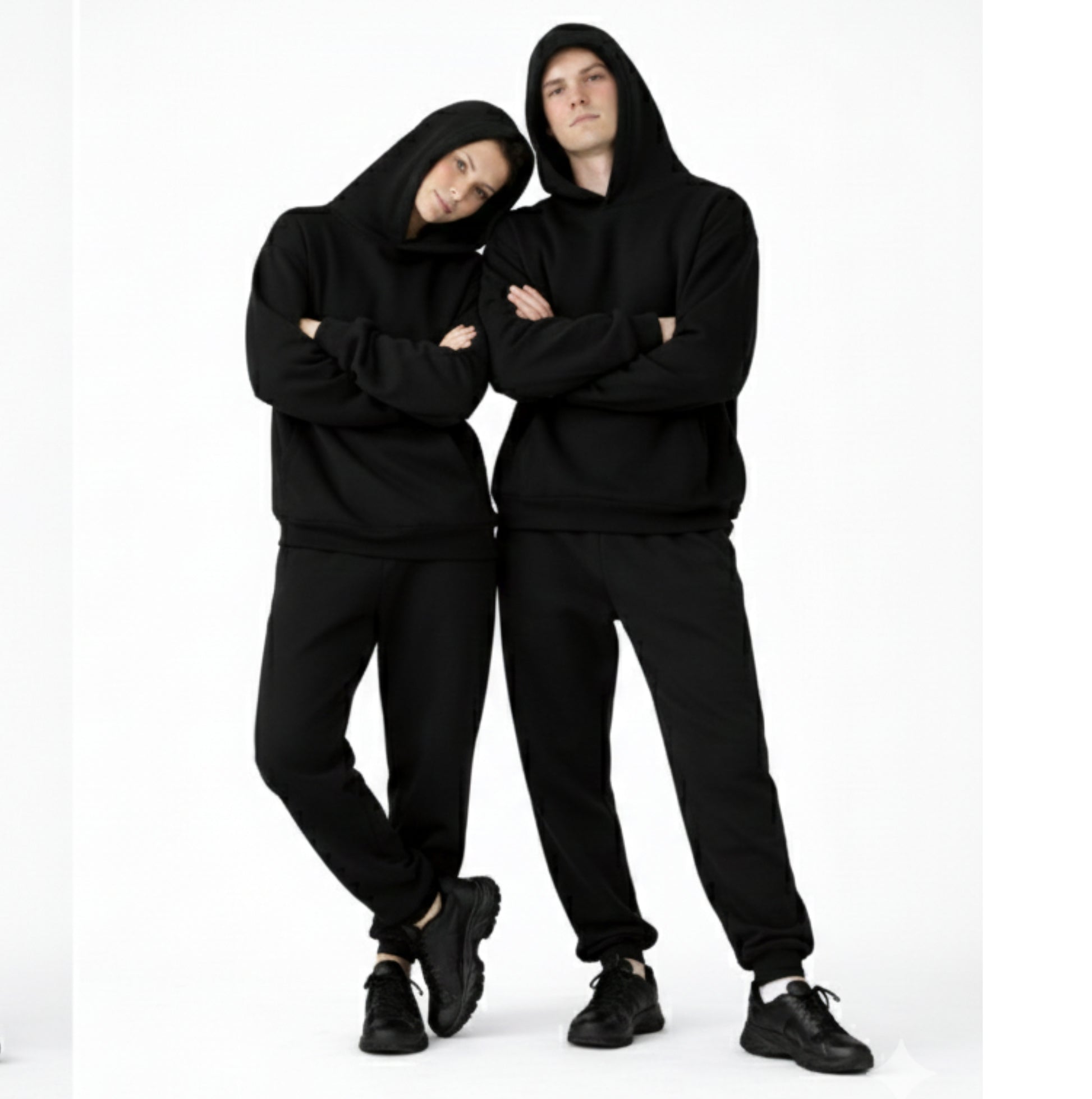 two people wearing dew oversized hoodies and joggers