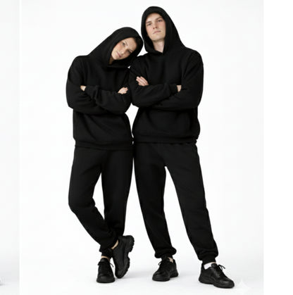 two people wearing dew oversized hoodies and joggers