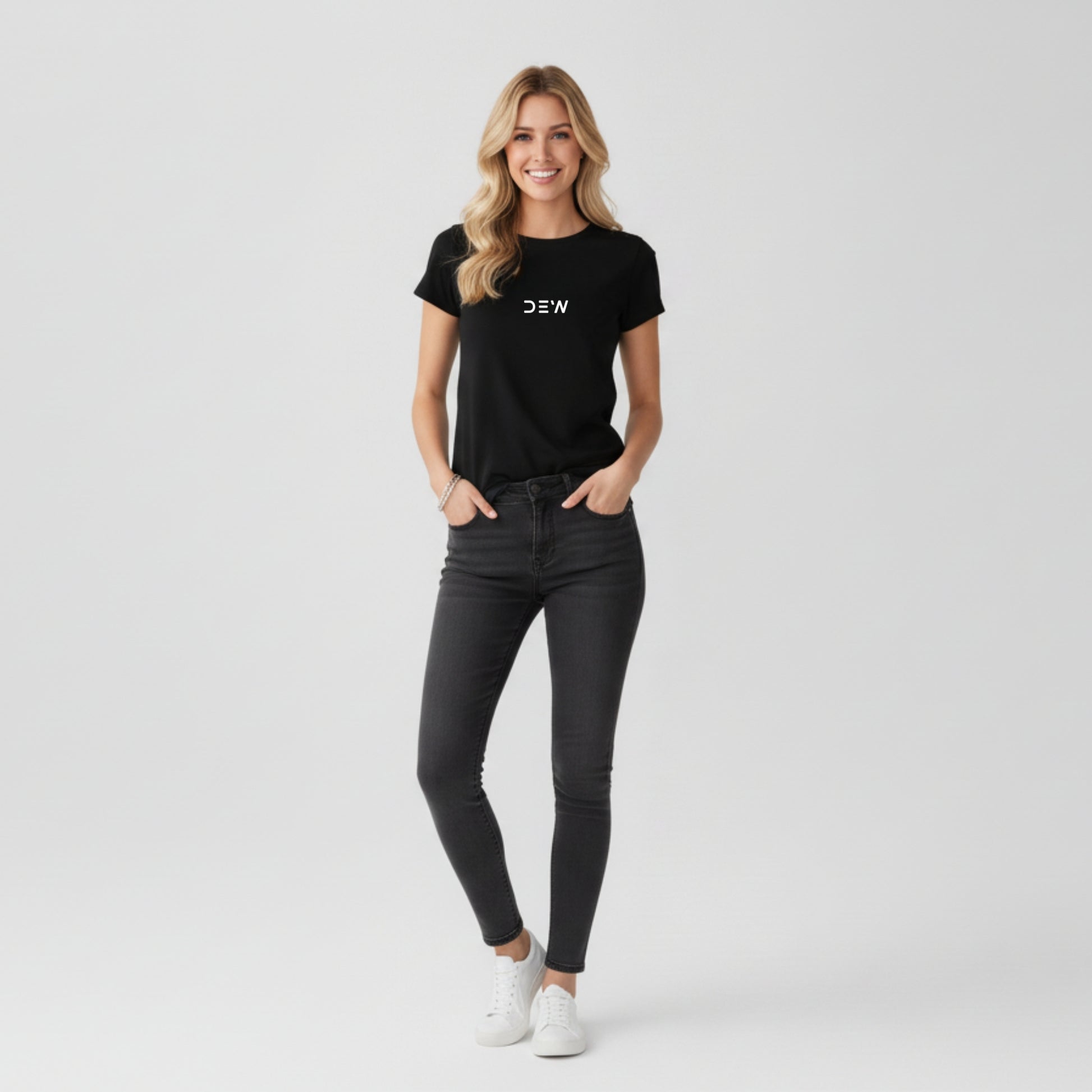 Woman wearing Dew black tee in a white background full image