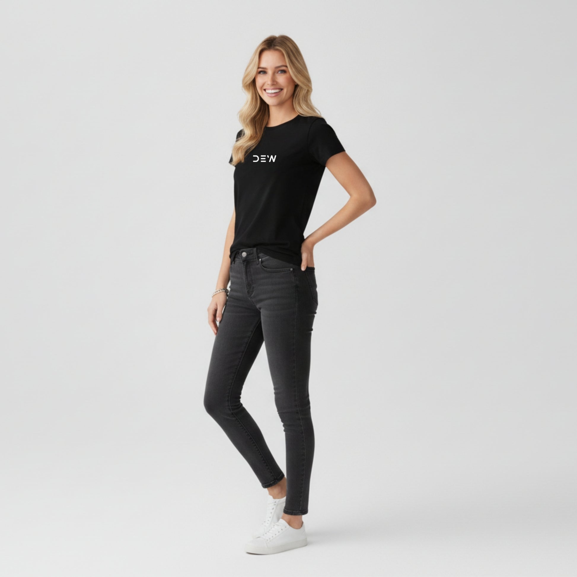 Woman wearing Dew black tee in a white background side image