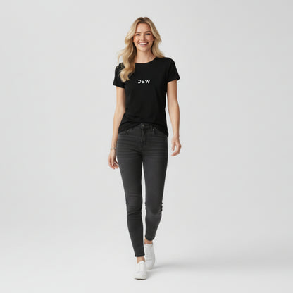 Woman wearing Dew black tee in a white background relaxed