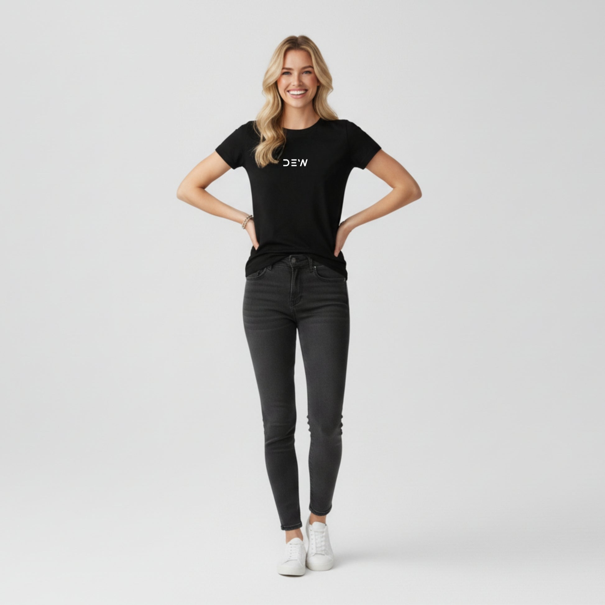 Woman wearing Dew black tee in a white background stylish