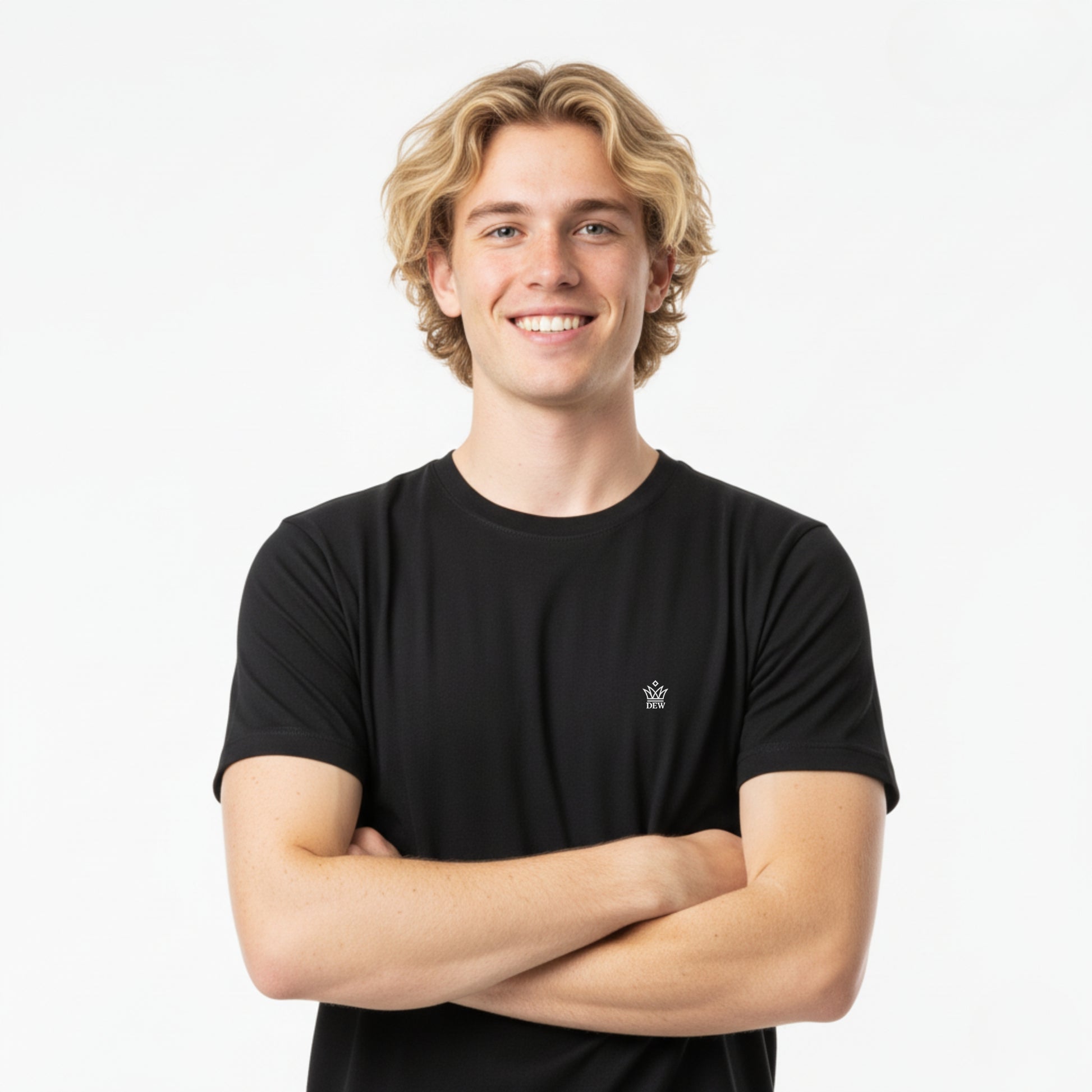 Person wearing a DEW 100% Cotton black t-shirt with a small embroidered Dew logo on a white background