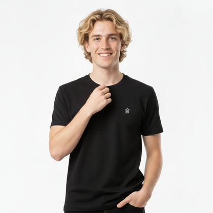 Person wearing a DEW 100% Cotton black t-shirt with a small embroidered Dew logo on a white background