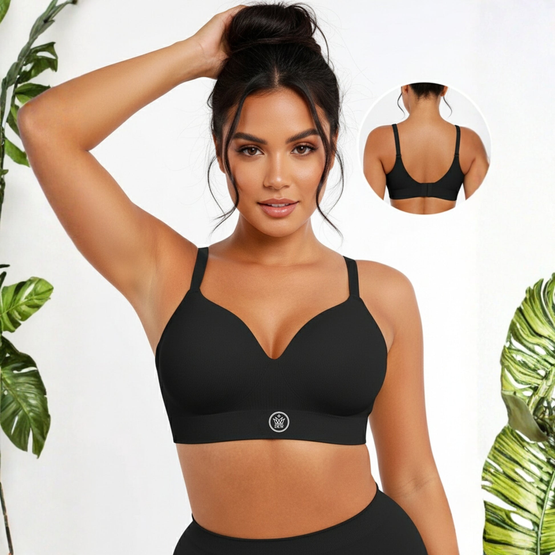 Woman wearing a black DEW Seamless Sculpt Bra with a white background and green plants.