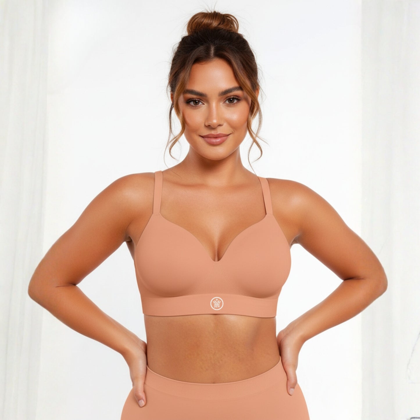 Woman wearing a beige DEW Seamless Sculpt Bra and leggings on a white background