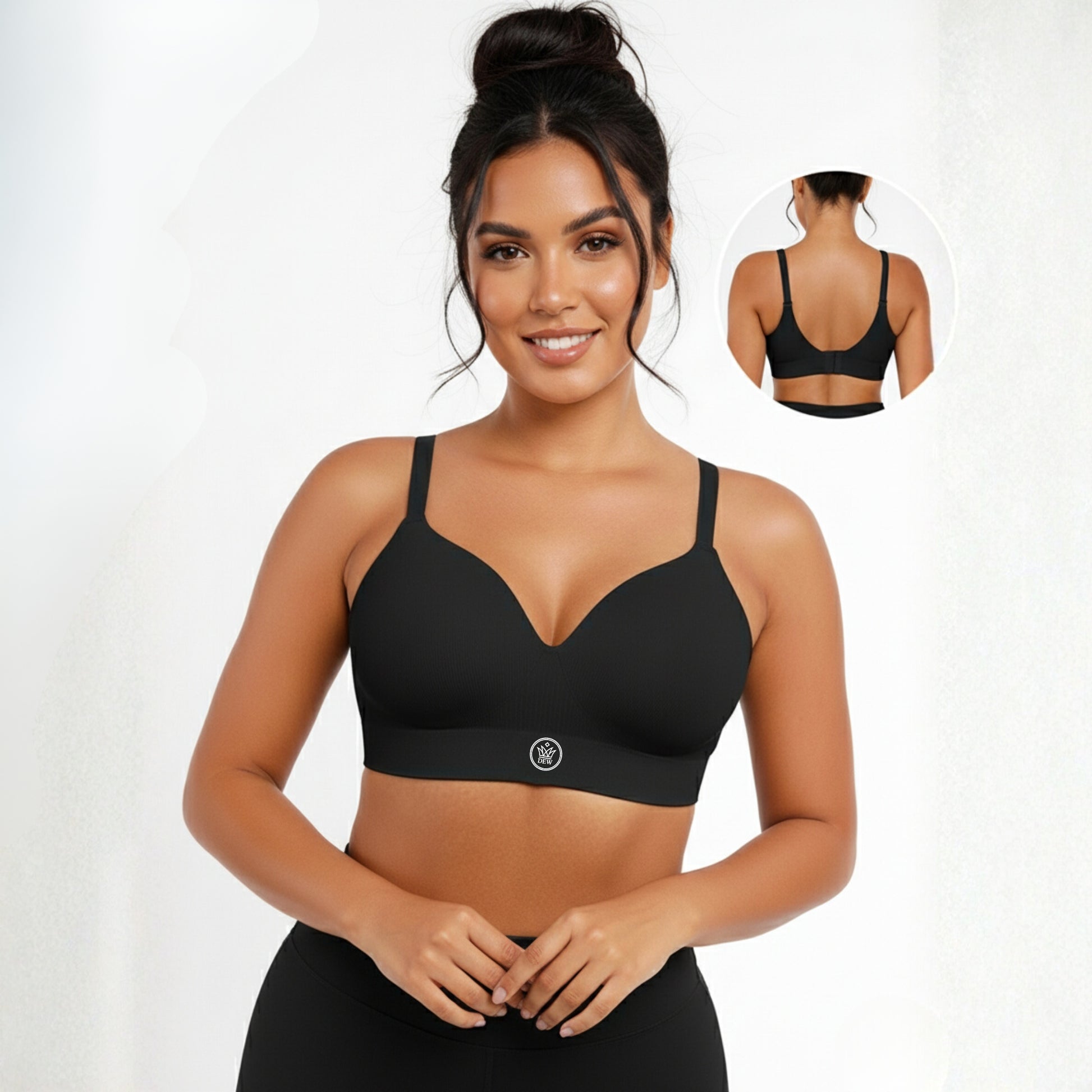 Woman wearing a black DEW Seamless Sculpt Bra with a white background