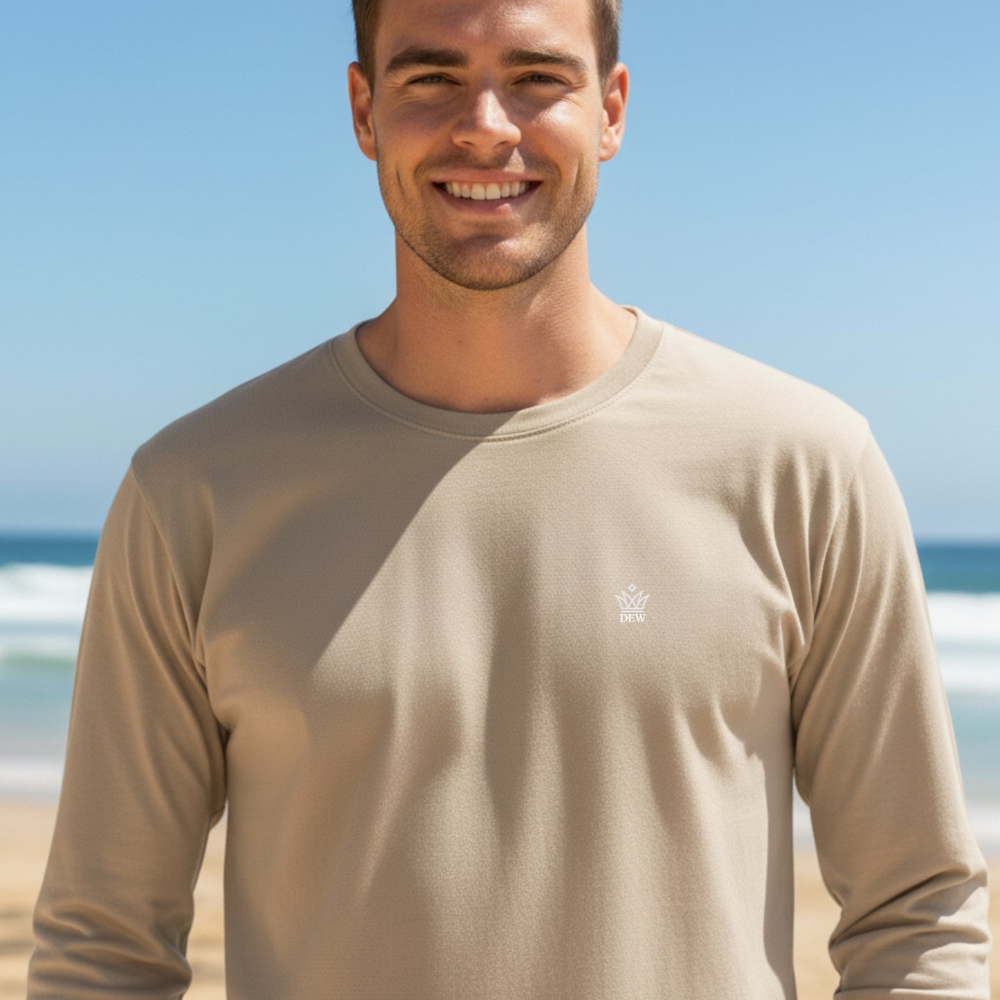Man wearing a Dew 100% cotton beige caramel long-sleeve shirt with a logo on a beach