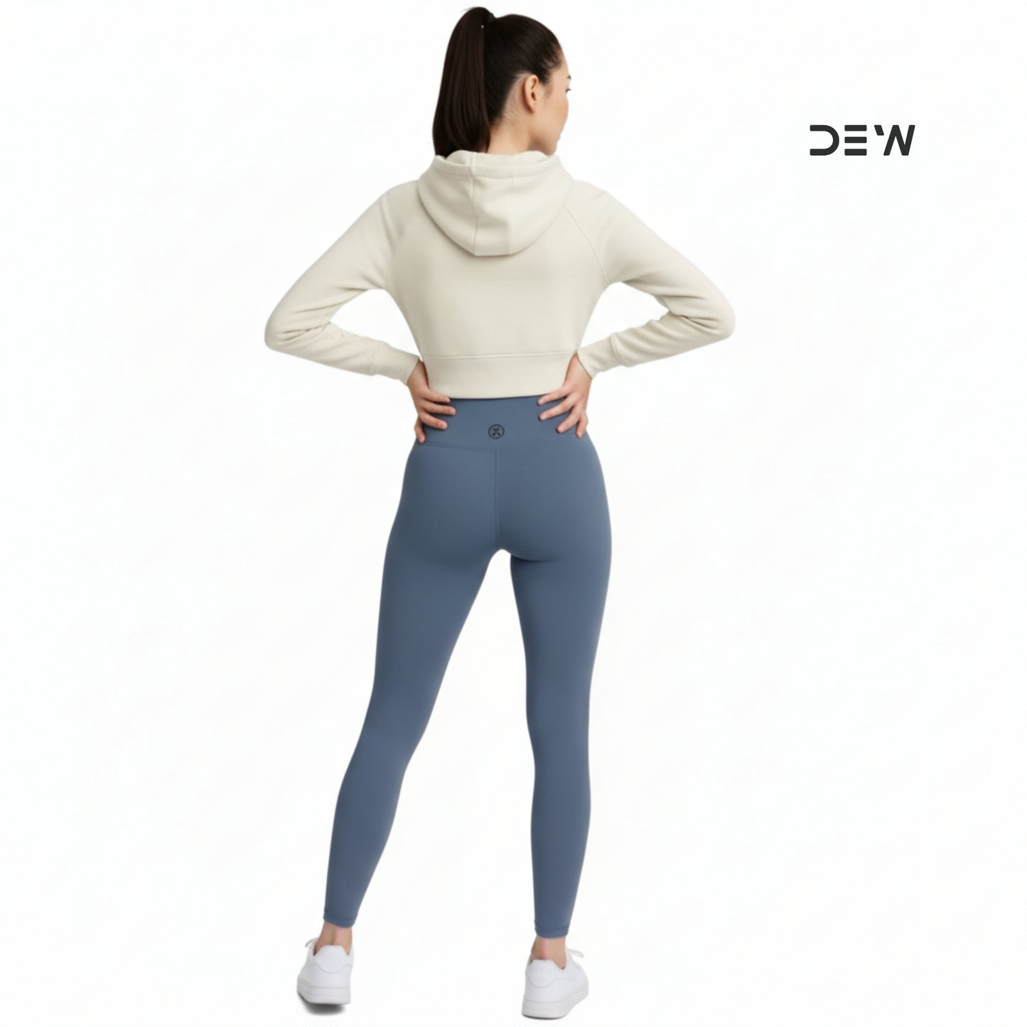 Person wearing a cream hoodie and Dew Core fit high waited leggings ocean mist  on a white background with 'DEW' branding.