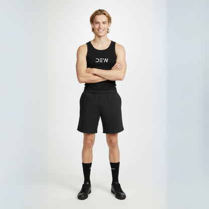 Person wearing a black tank top, shorts and Dew crew socks with 'DEW' branding on a white background