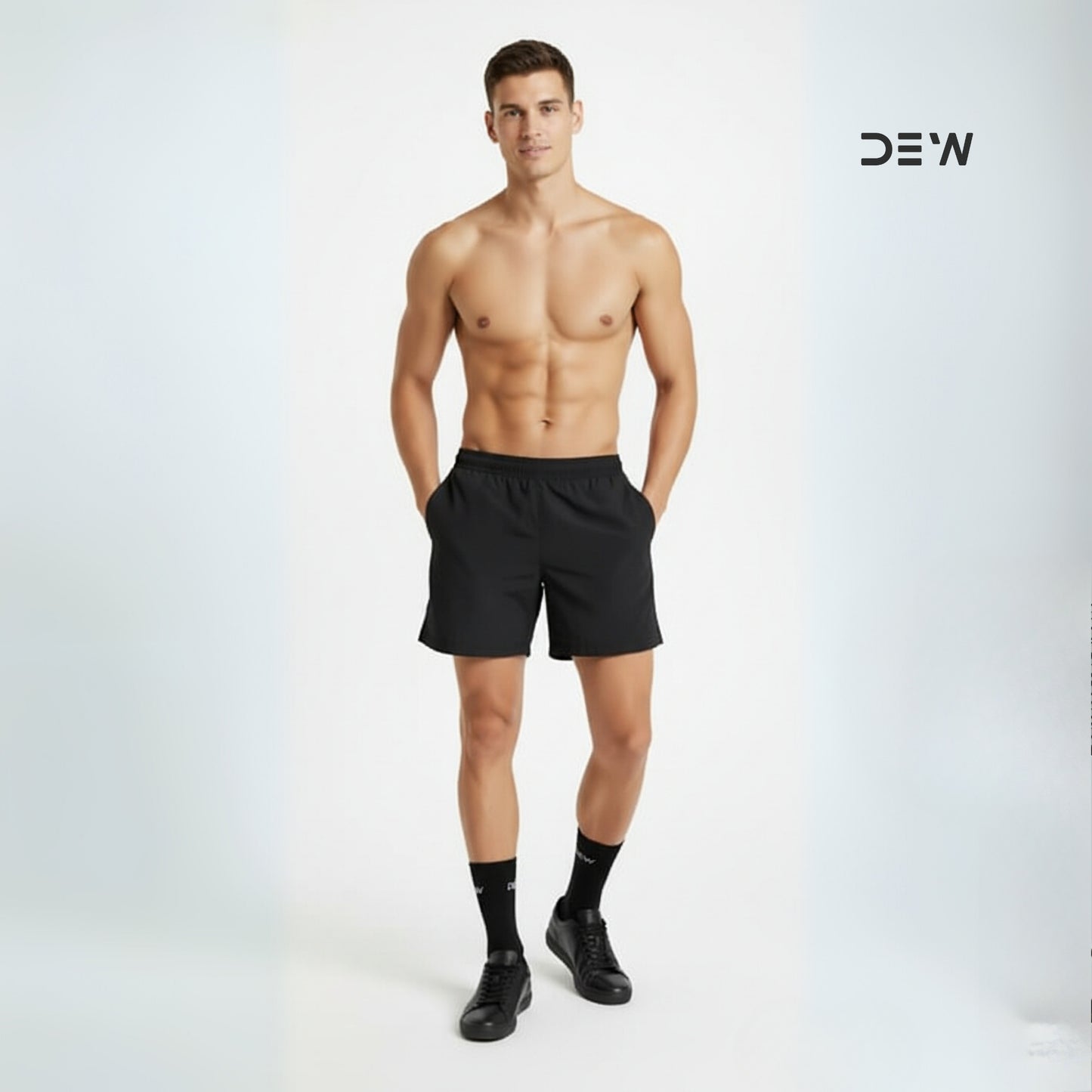 Man wearing black shorts and Dew crew socks on a white background with 'DEW' branding.