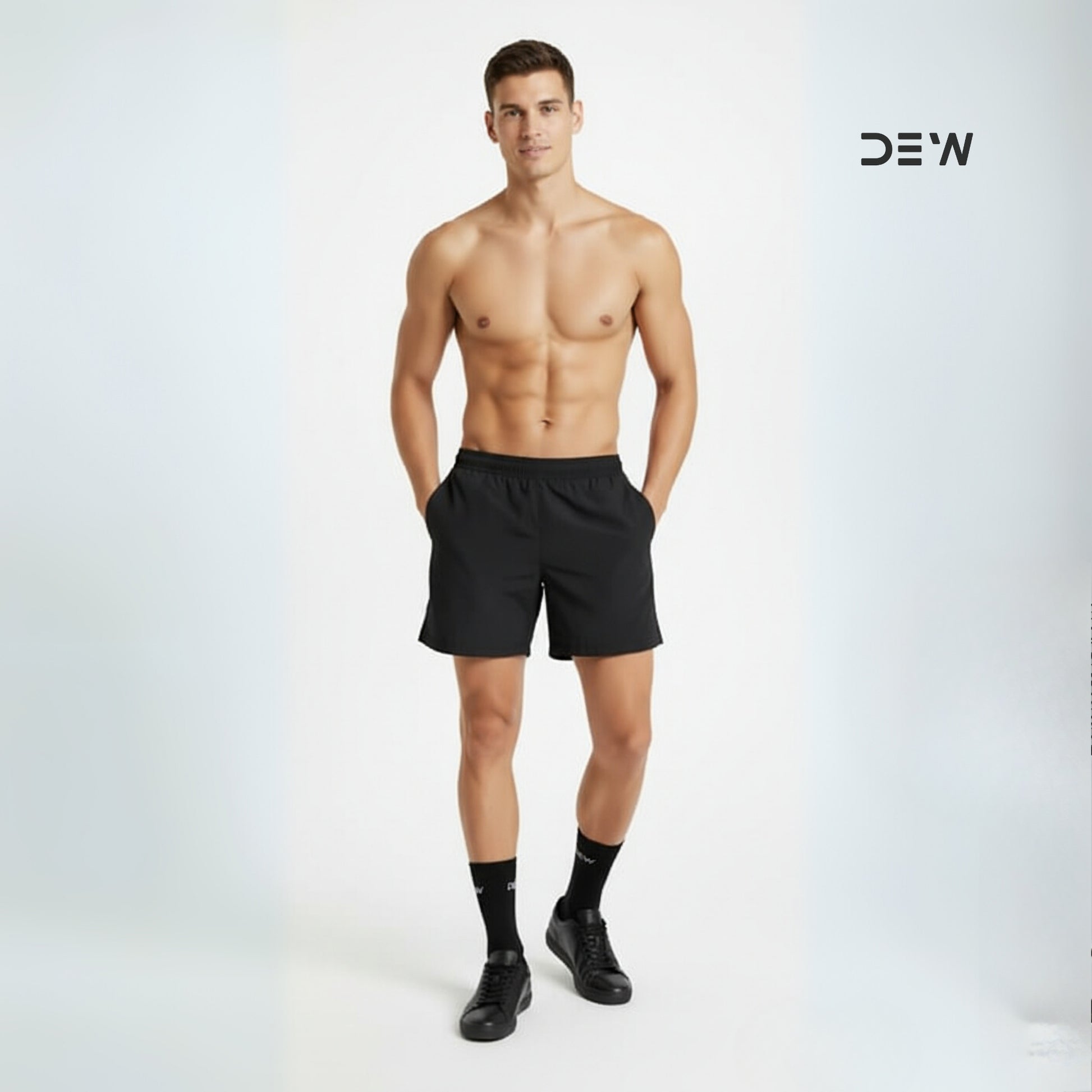 Man wearing black shorts and Dew crew socks on a white background with 'DEW' branding.