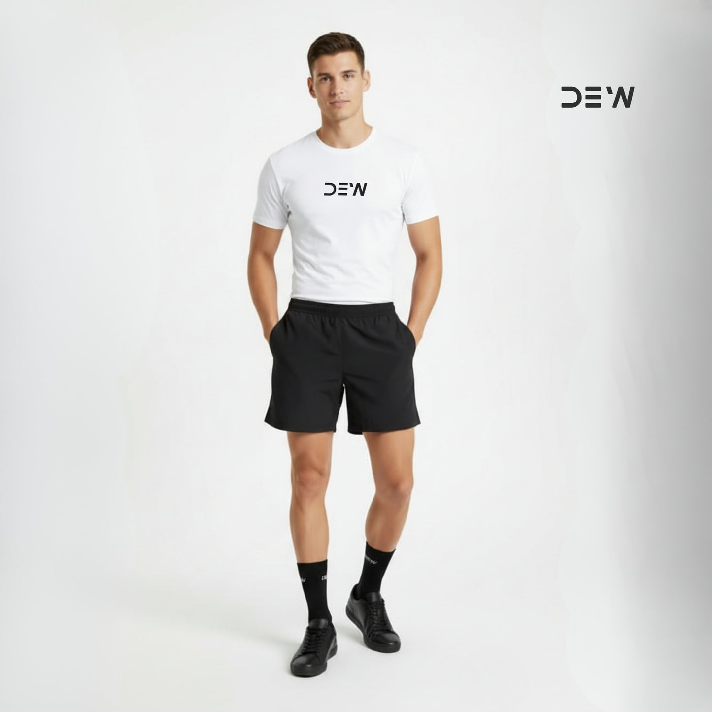 Man wearing a white t-shirt, black shorts and Dew crew socks with 'DEW' branding on a light gray background.