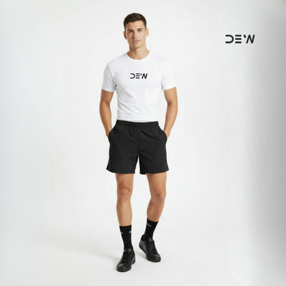 Man wearing a white t-shirt, black shorts and Dew crew socks with 'DEW' branding on a light gray background.