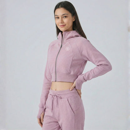 woman wearing Dew crop zip jacket side view