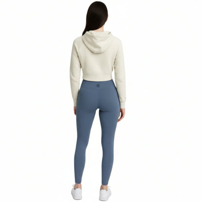 Person wearing a white hoodie and Dew ocean mist leggings leggings on a white background
