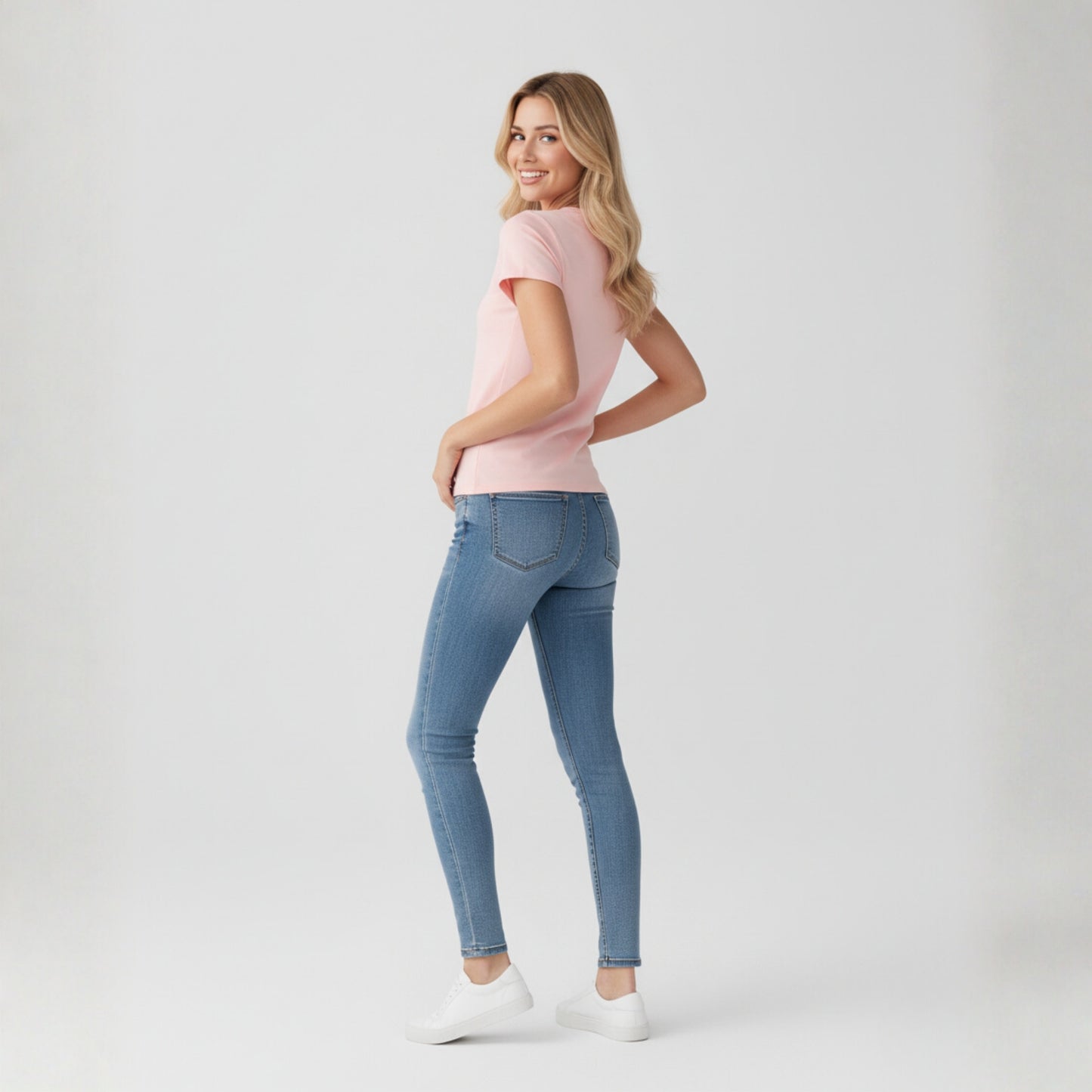 Woman wearing Dew petal pink tee in a white background