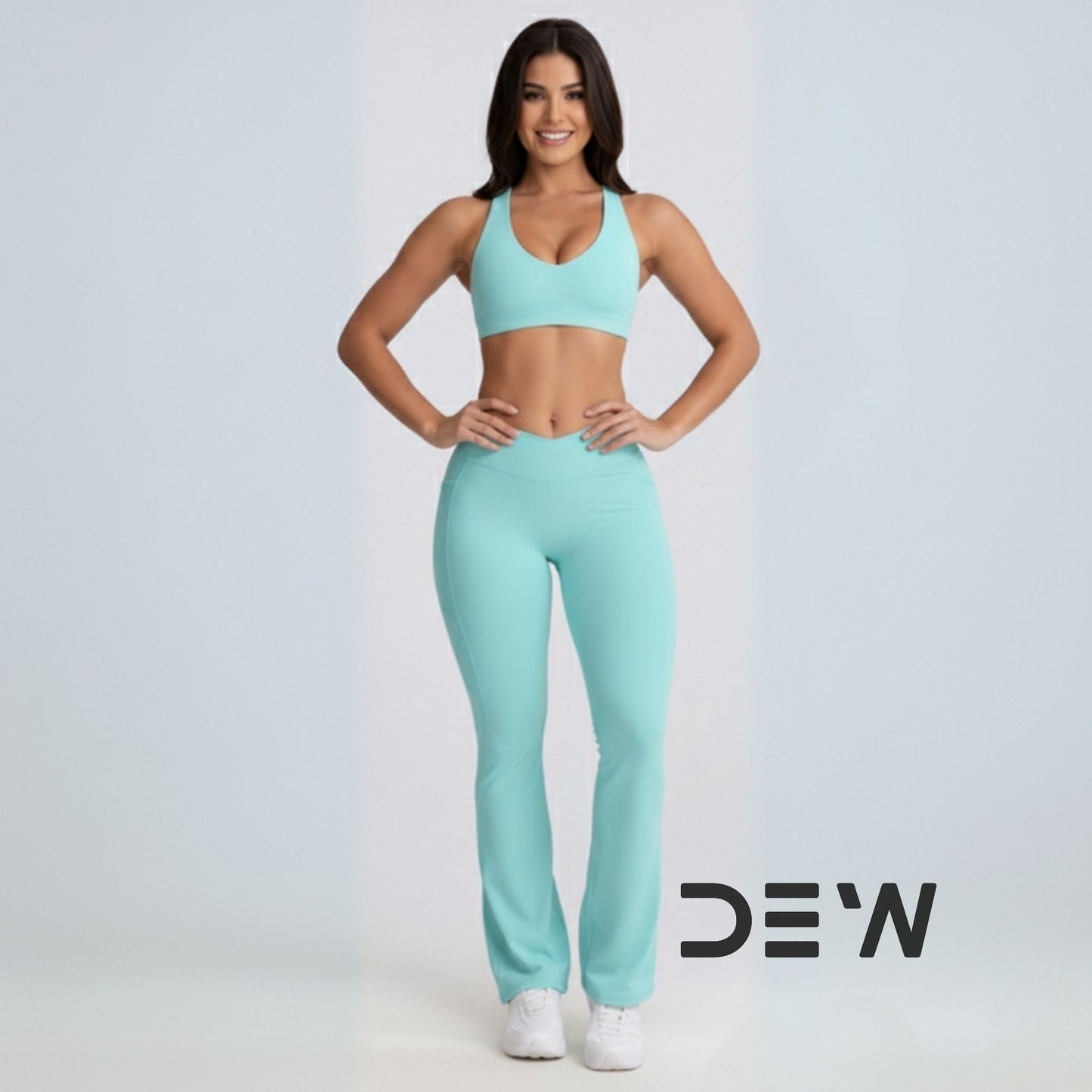 Woman wearing full mint seamless activewear set: seamless sports bra and Flow Fit Flare leggings. Studio shot highlighting comfortable fit.