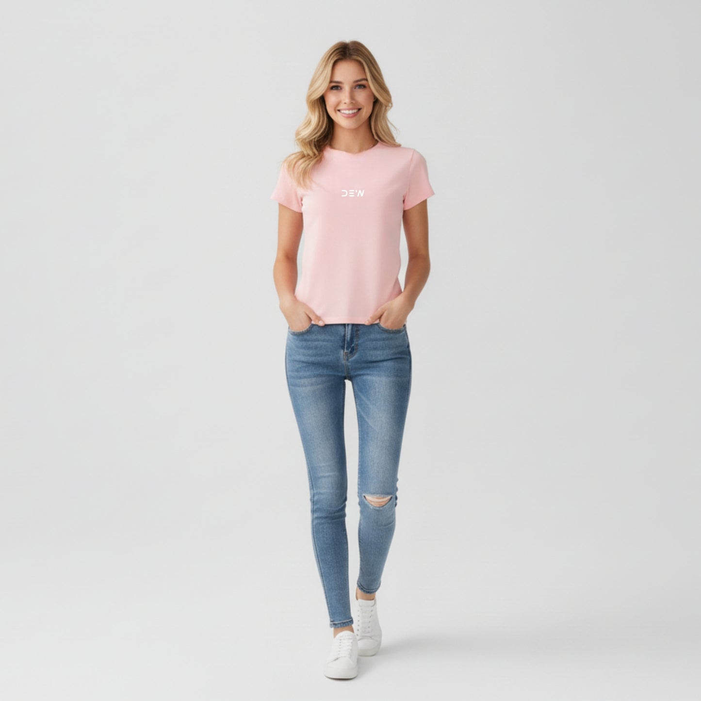 Woman wearing petal pink Dew tshirt in plain backgound