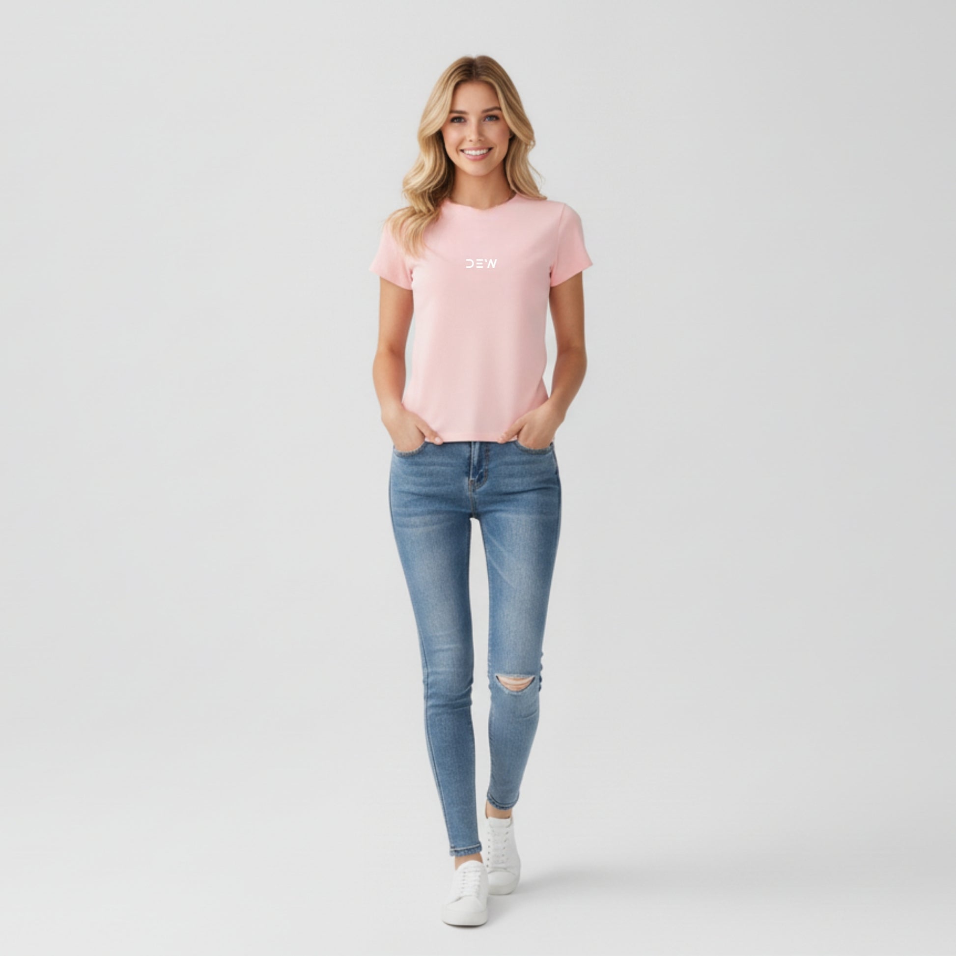 Woman wearing petal pink Dew tshirt in plain backgound