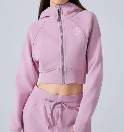 Pink Women's Premium Crop Zip Jacket and sweatpants set on a plain background
